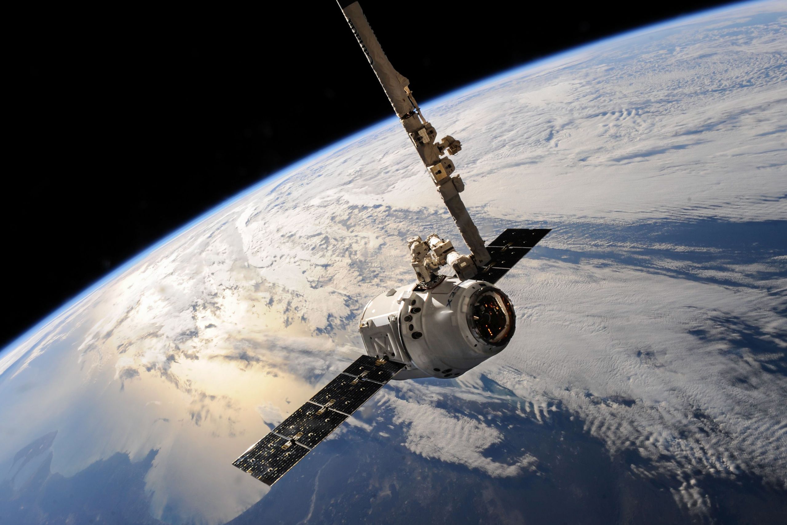 What Is Space TechnologyWhat Is Space Technology A satellite glides over Earth showcasing dramatic cloud formations and the vast expanse of space.