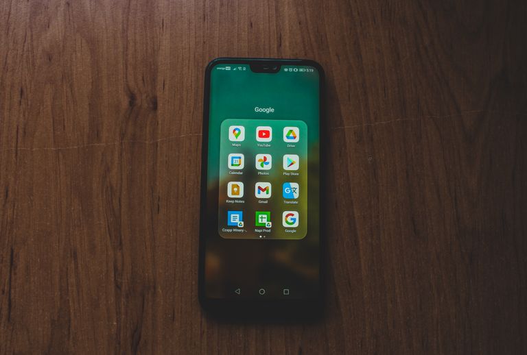 The Google Pixel 11 series continues Google's focus on smartphone photography, combining upgraded camera A smartphone showcasing various Google apps on a wooden table.