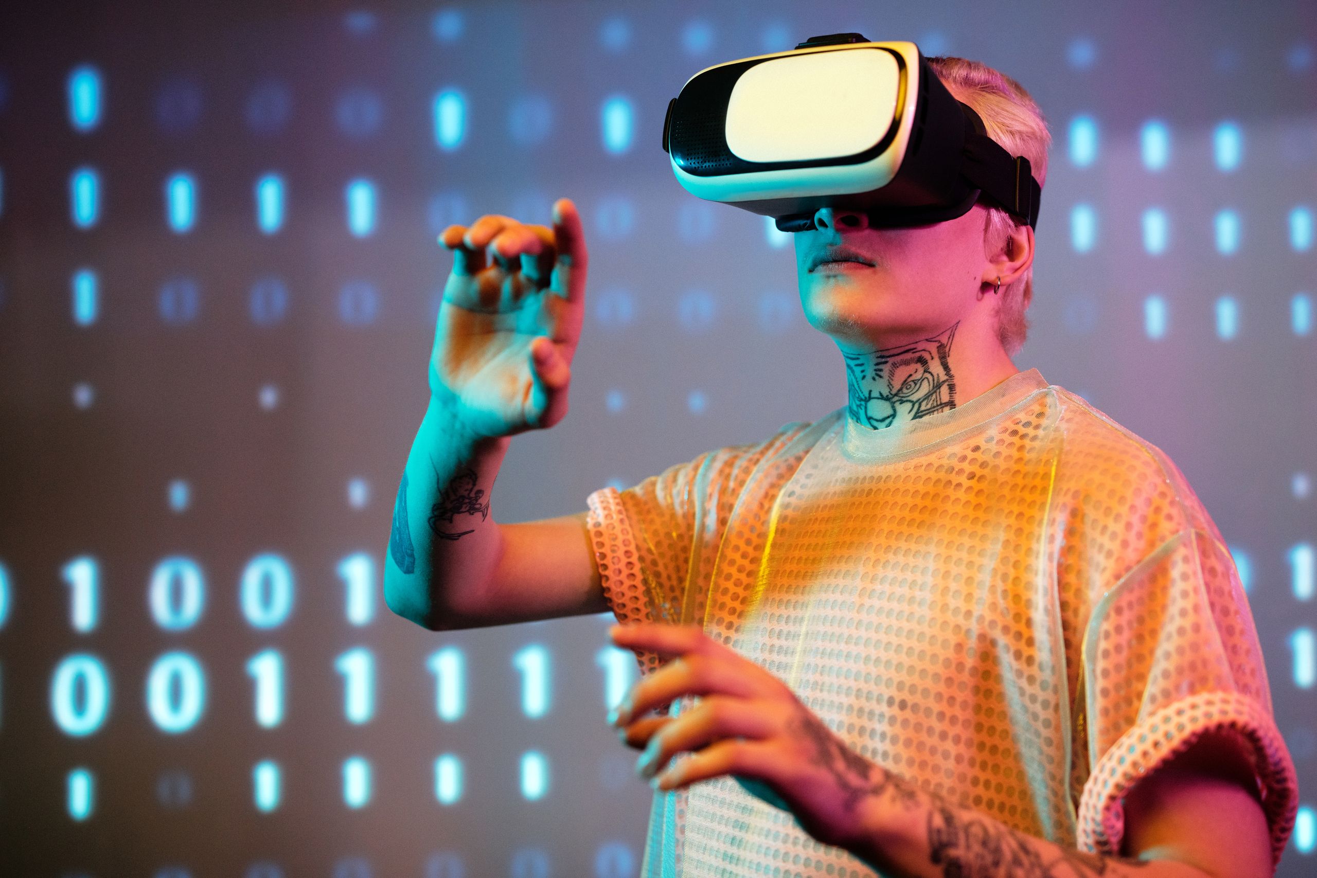 Future Technology A young man interacts in virtual reality wearing a headset with a digital binary background.