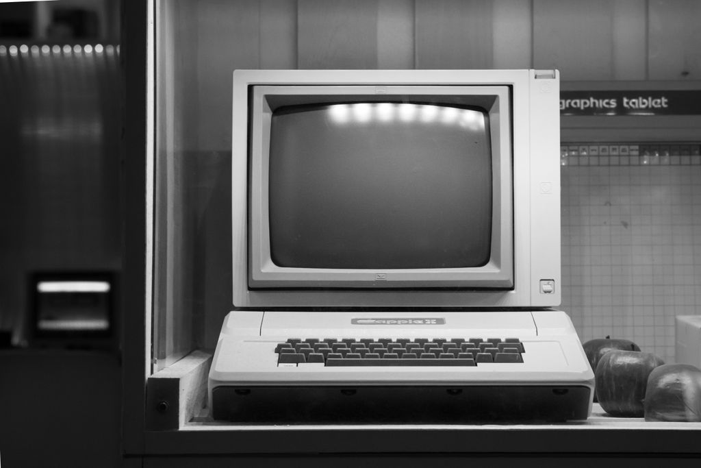 Black and white image of a classic Apple II computer on display in Wrocław, Poland.