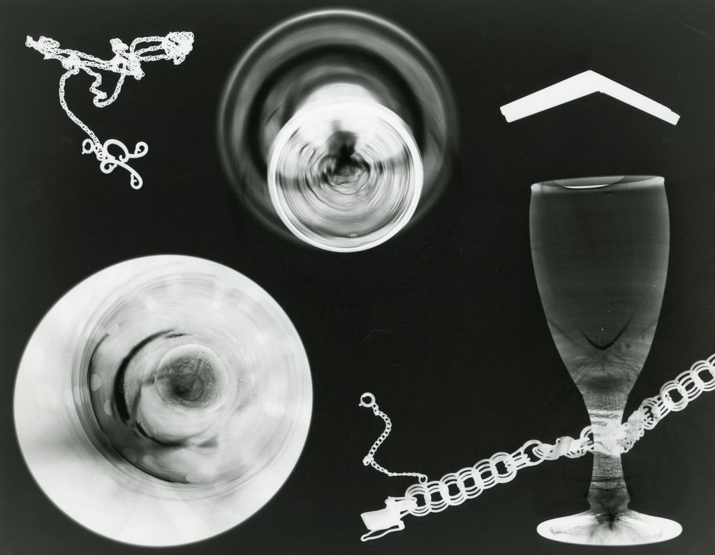Creative abstract art featuring x-ray imagery of glass objects and chains.