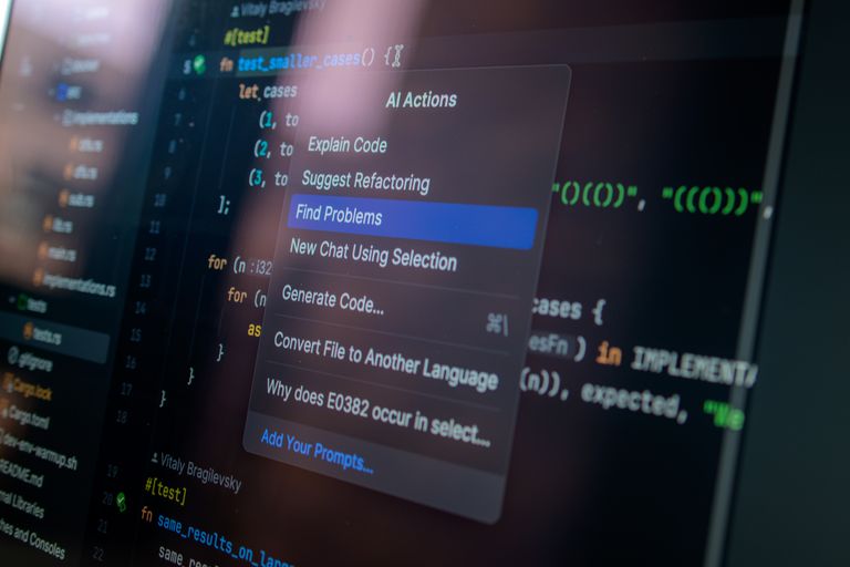 AI Tools Detailed view of a computer screen displaying code with a menu of AI actions, illustrating modern software development.