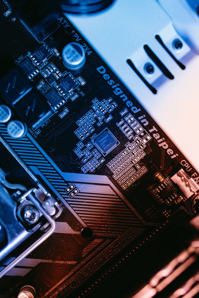 Macro shot of a computer motherboard focused on chips and circuits, designed in Taipei.